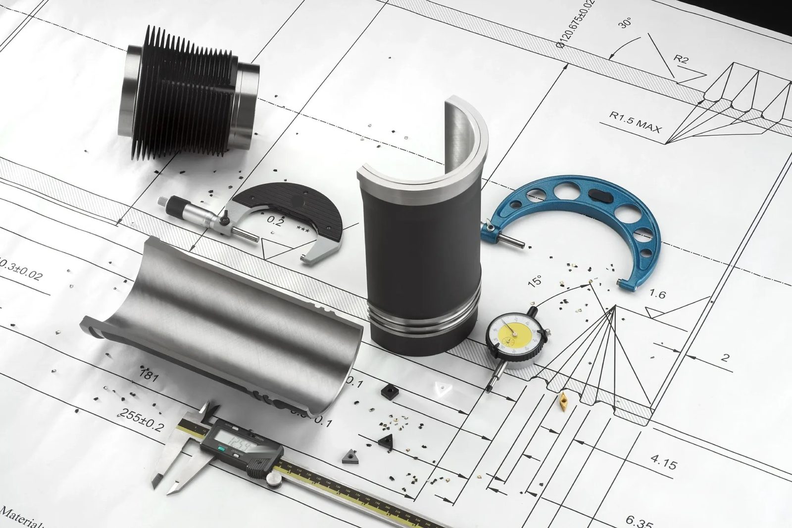 A cylinder liner and measuring gauges laid on its drawing
